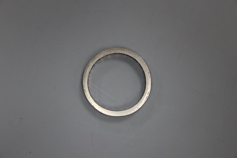 A white metal and diamond set full eternity ring, size O, gross 2.8 grams.